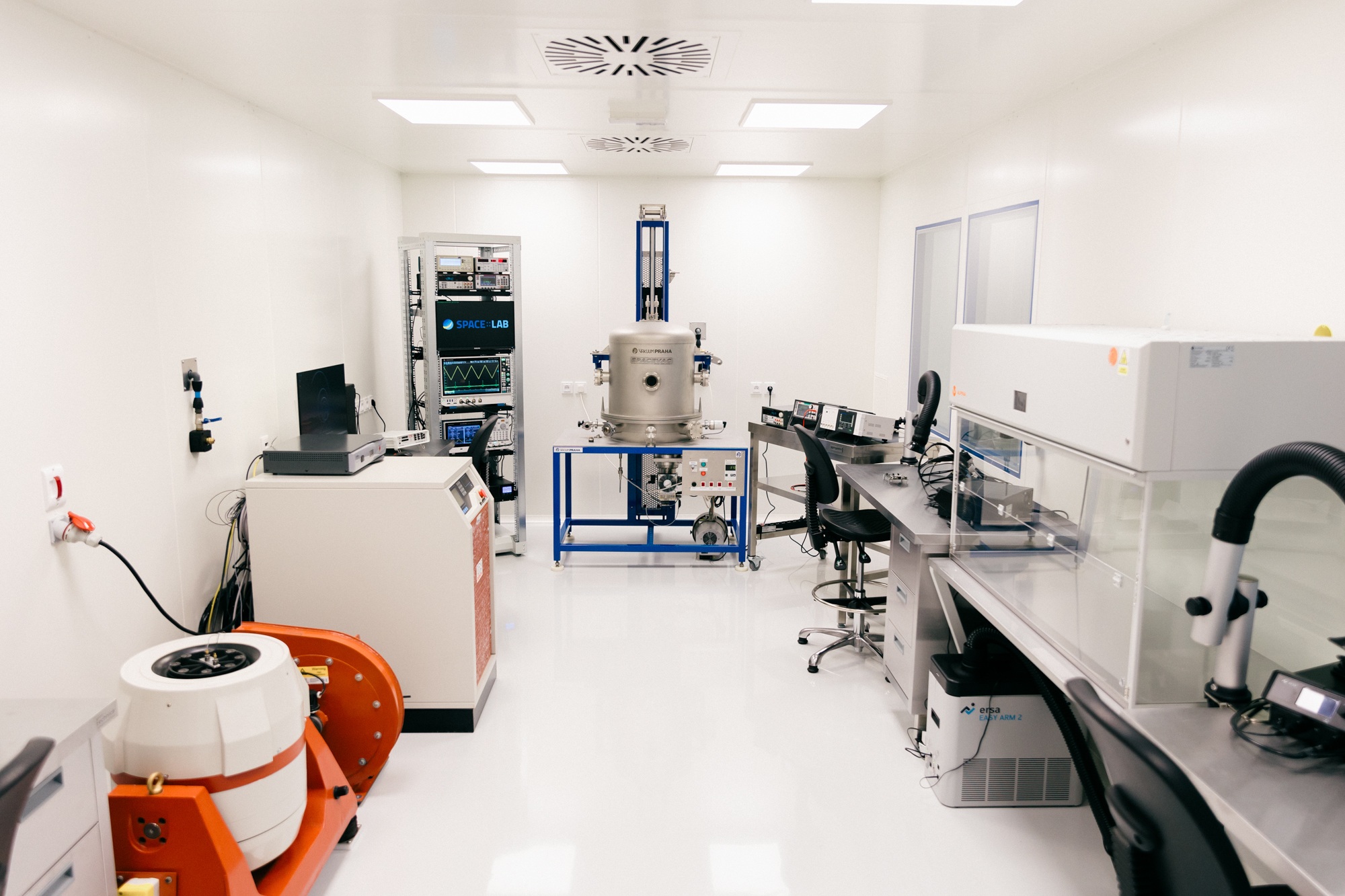 The interior of the space cleanroom in Košice, with the vibration shaker, SPACEVAC chamber and laminar flow bench